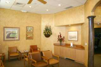 {PRACTICE_NAME} reception area with chairs for patients Wichita KS