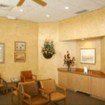 {PRACTICE_NAME} reception area with chairs for patients Wichita KS